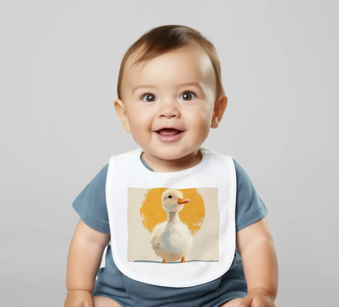Cute duckling standing tall with a round yellow backdrop baby bib by DesignDoodle