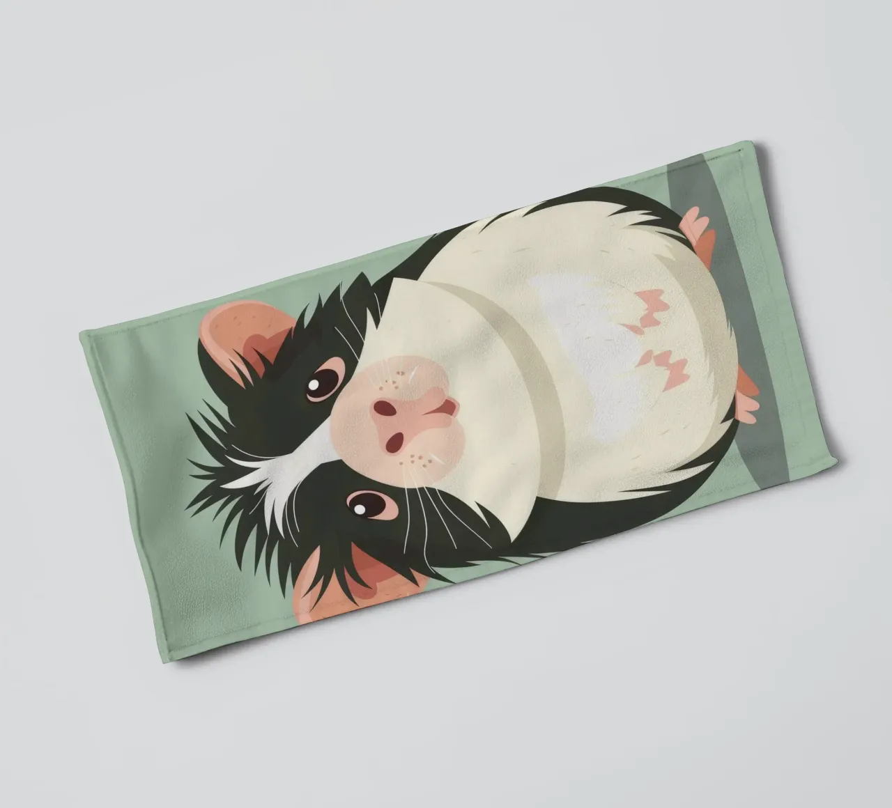 Mignon cochon d'Inde noir et blanc illustré dans un vert clair. serviette de bain de DesignDoodle