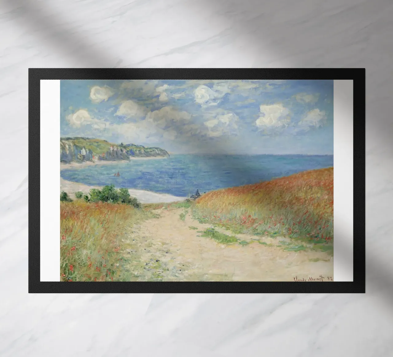 a road leading through wheat fields to cliffs and the sea doormat by SMG Store