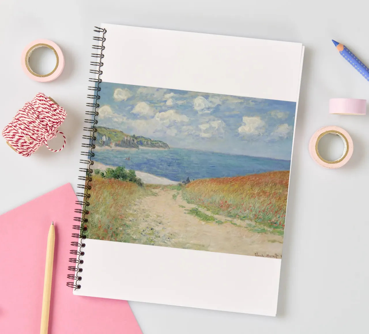 a road leading through wheat fields to cliffs and the sea spiral notebook by SMG Store