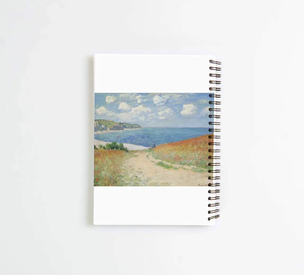 a road leading through wheat fields to cliffs and the sea spiral notebook by SMG Store