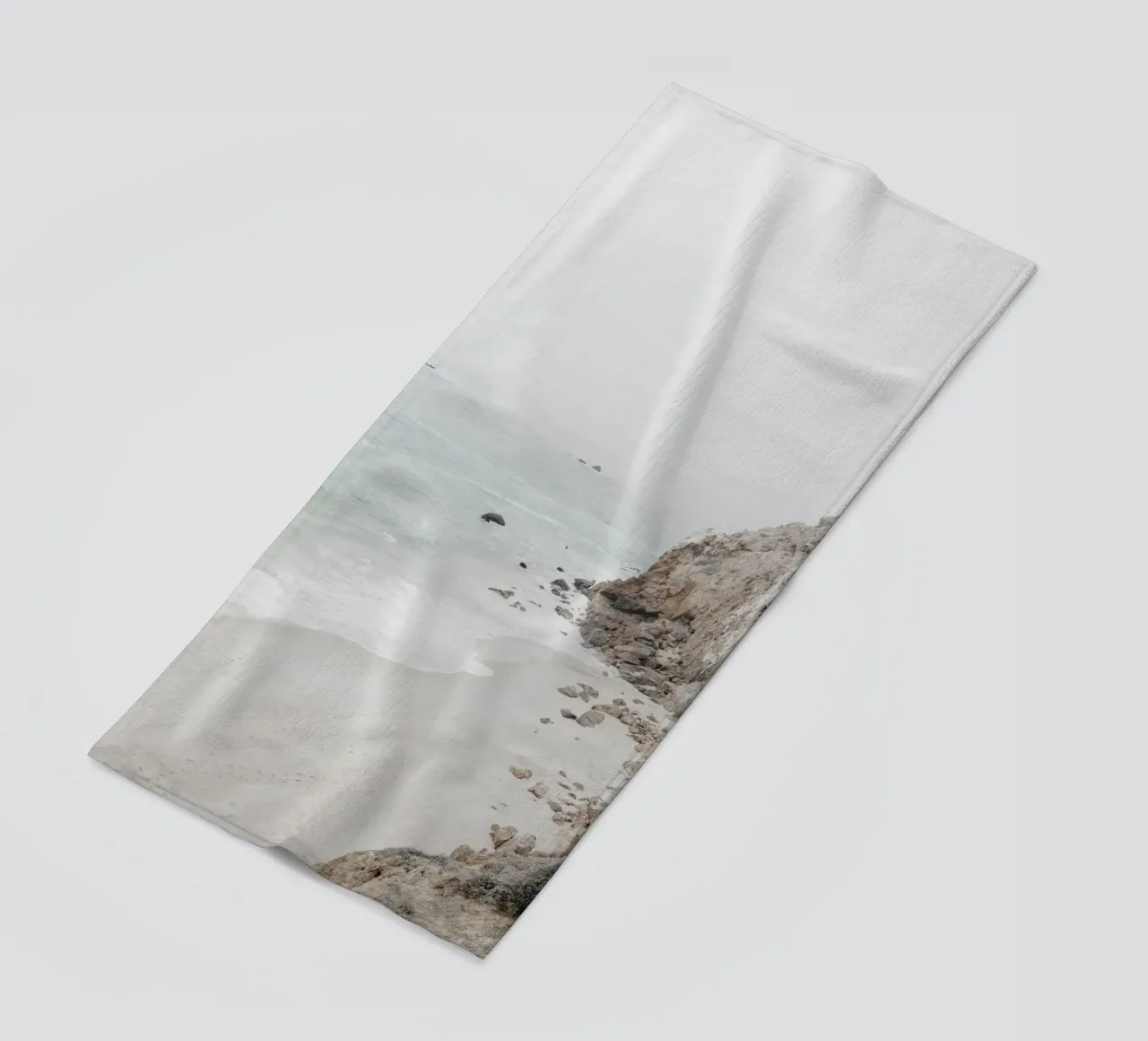 Coastal Cliffs and Beach beach towel by Indigo Tides Art