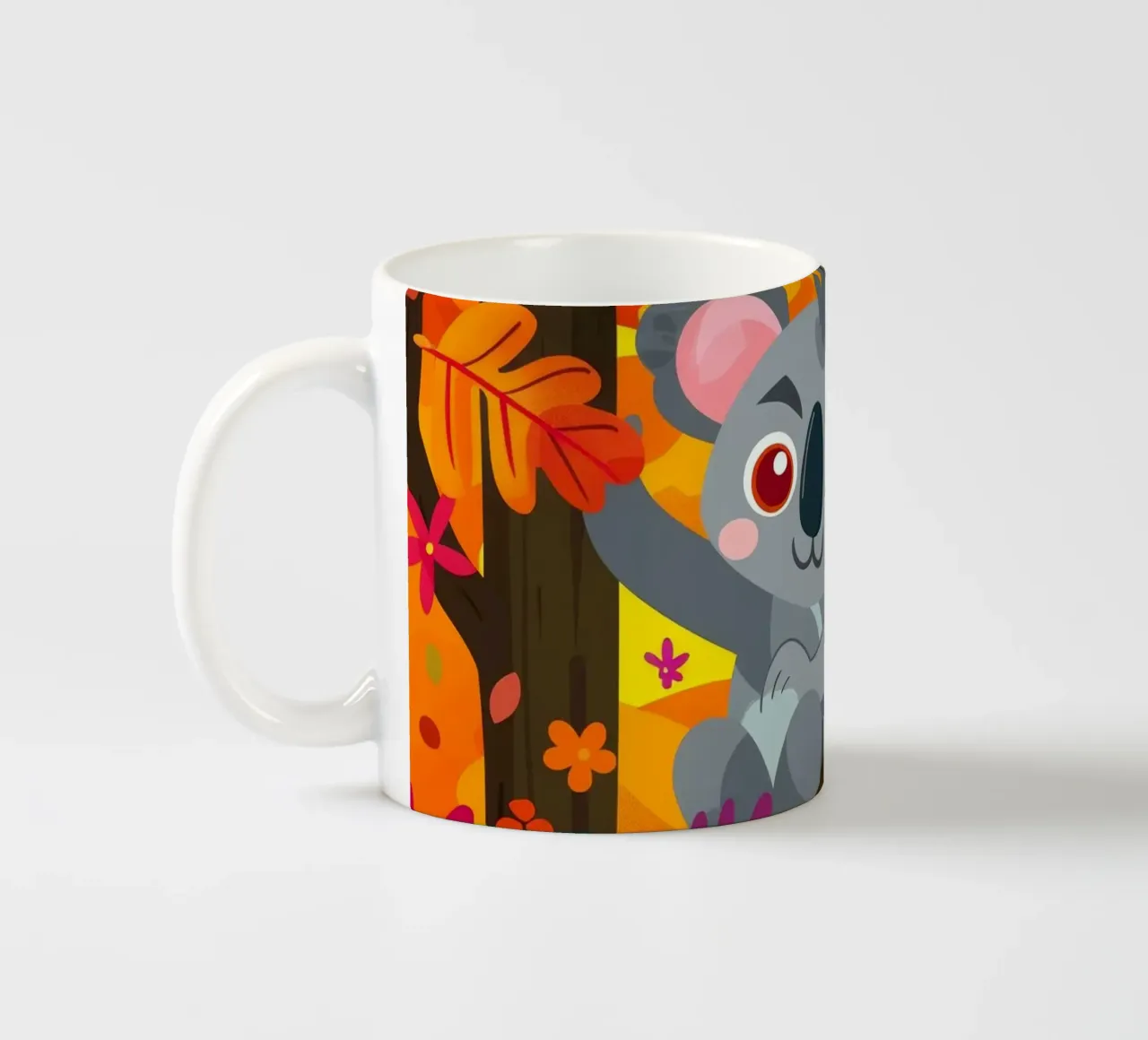 Koala seduto su un albero circondato da foglie autunnali tazza in ceramica da DesignDoodle