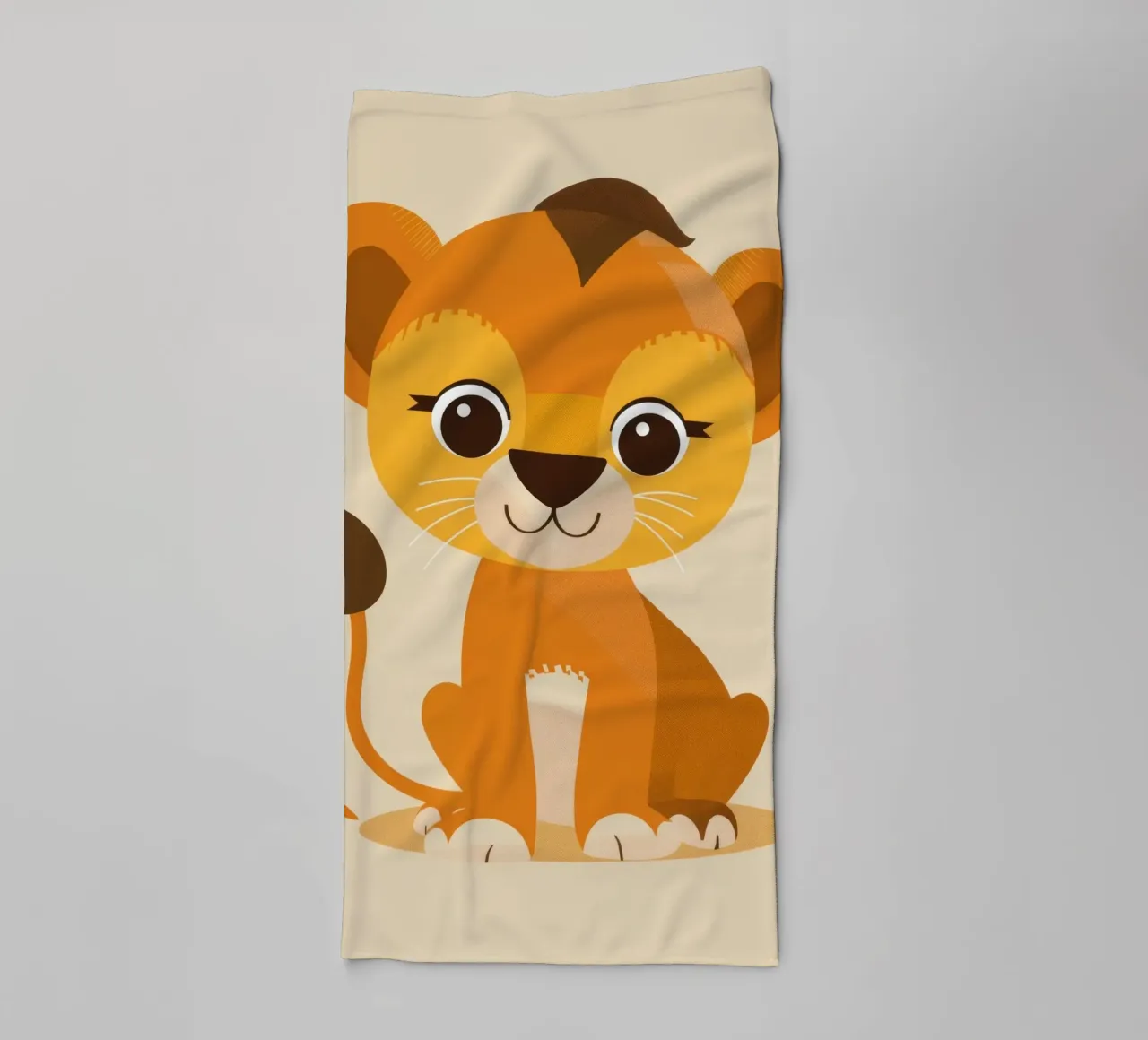 Cartoon lion cub sits playfully against a light background towel by DesignDoodle