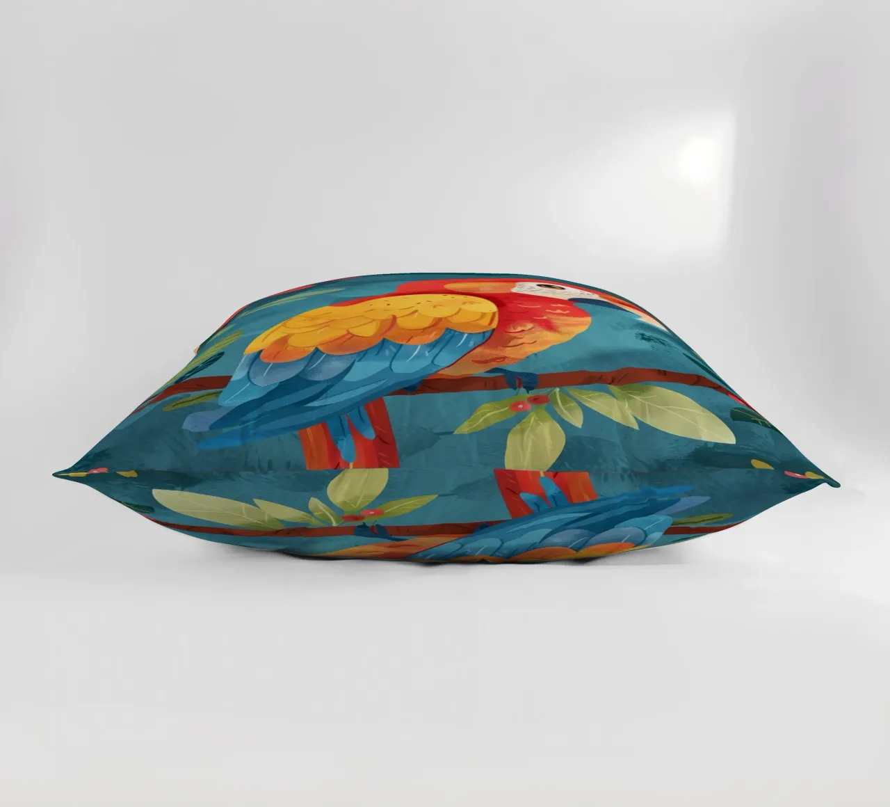 Ara colorata appollaiata su un ramo tra il fogliame lussureggiante cuscino da DesignDoodle