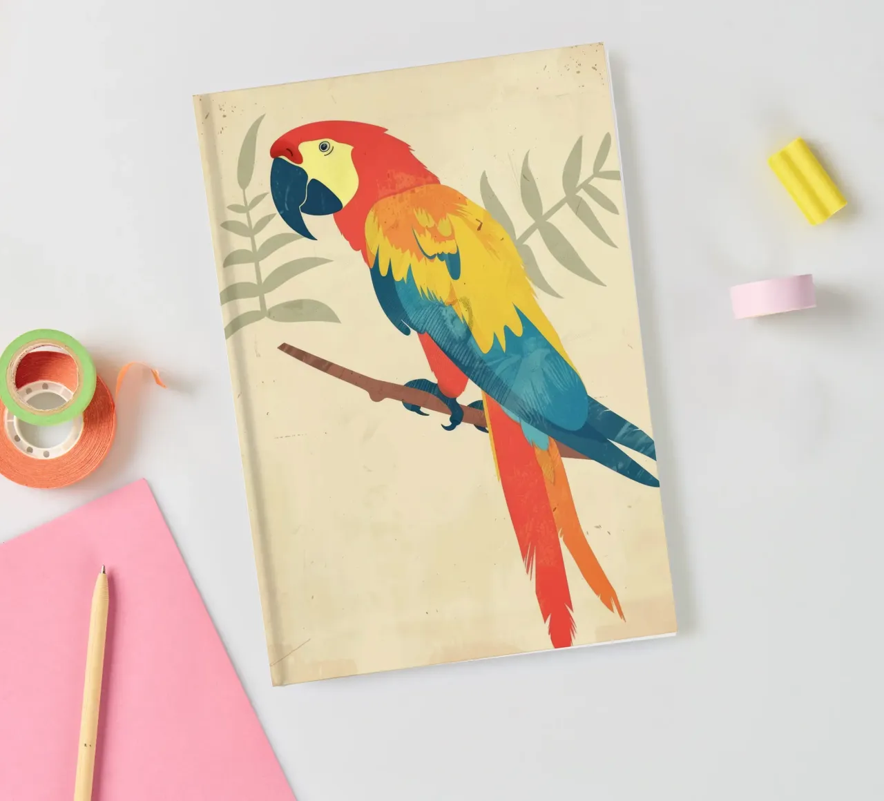 Bright parrot perched on a branch surrounded by subtle folia notebook by DesignDoodle