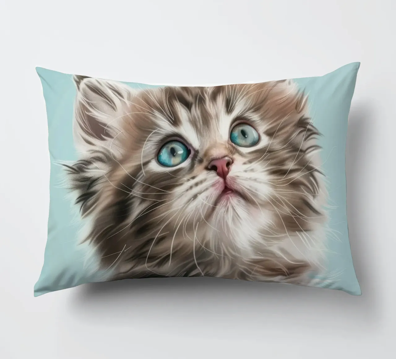 Adorable fluffy kitten gazing upward with striking blue eyes decorative cushion by DesignDoodle