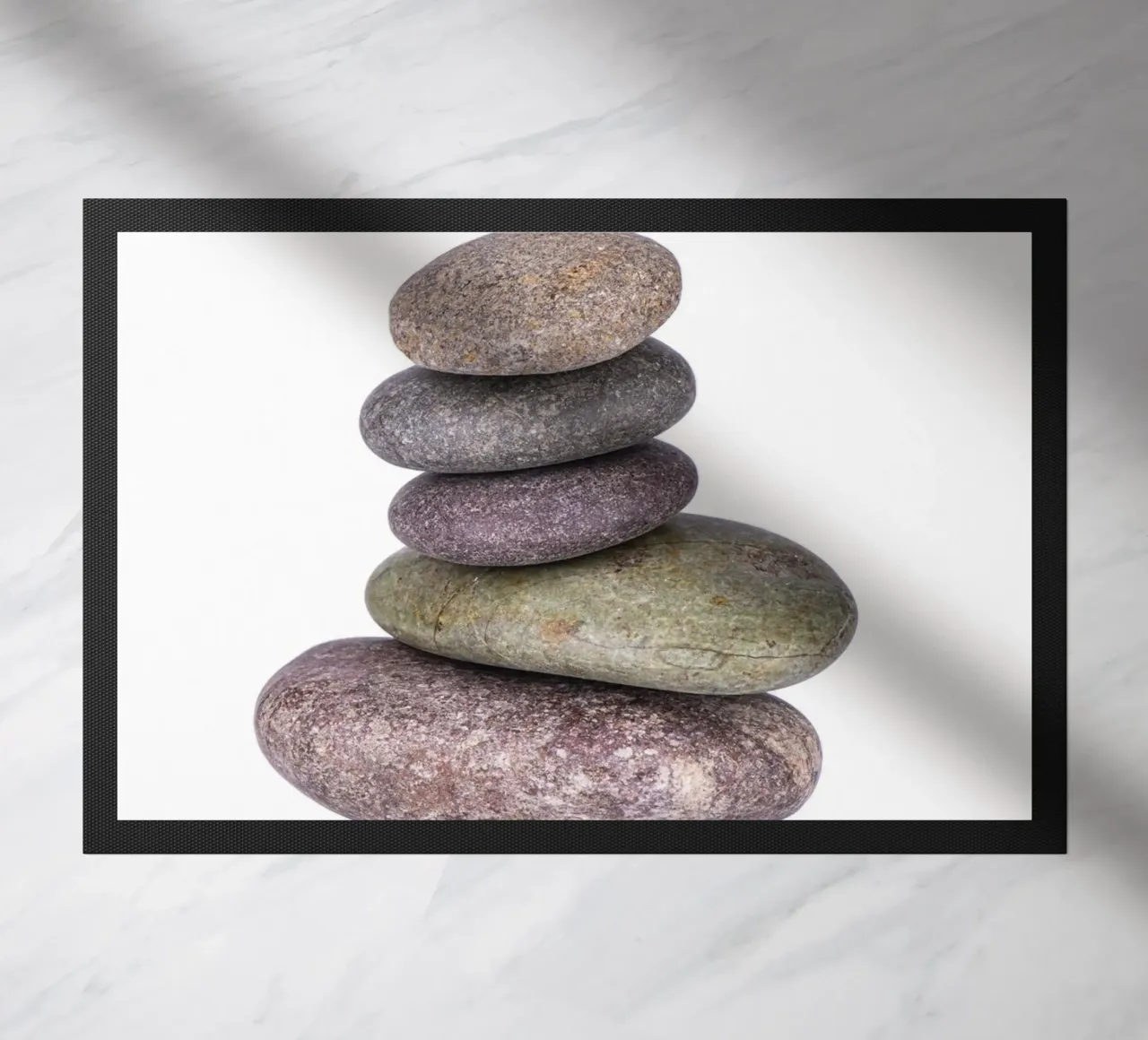 Stone stack in balance against a white background doormat by Bilderwelt - Kunst für die Wand