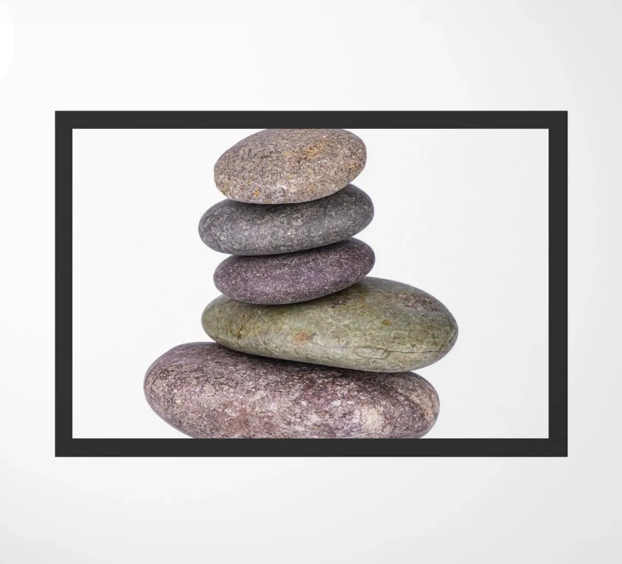 Stone stack in balance against a white background doormat by Bilderwelt - Kunst für die Wand