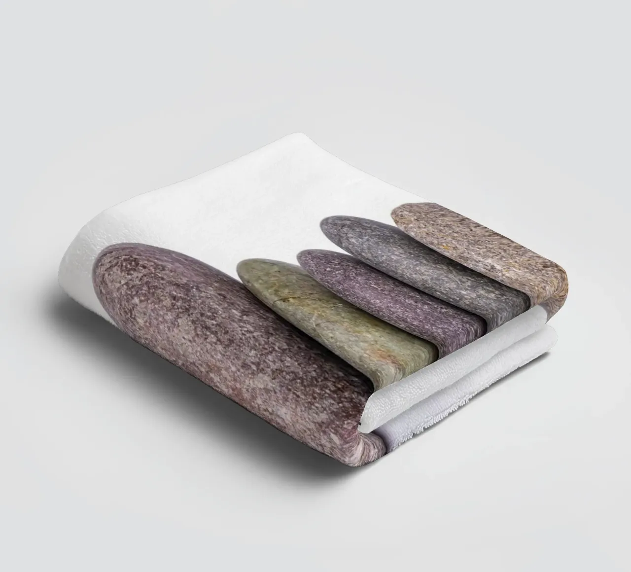 Stone stack in balance against a white background towel by Bilderwelt - Kunst für die Wand