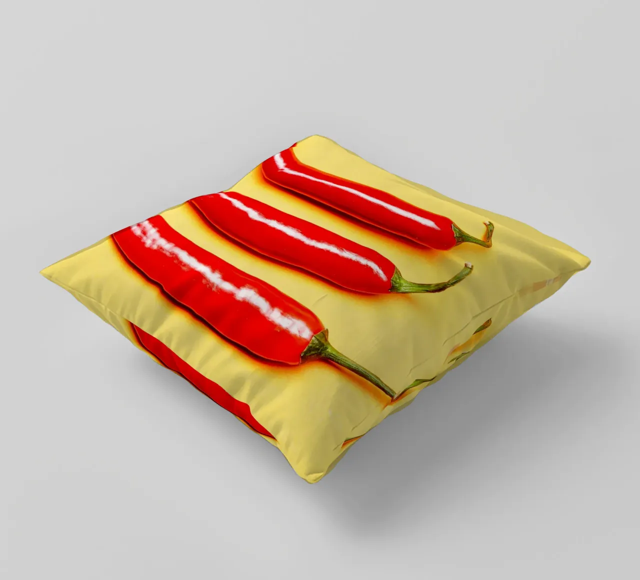 Red chilli peppers on a yellow surface decorative cushion by Bilderwelt - Kunst für die Wand