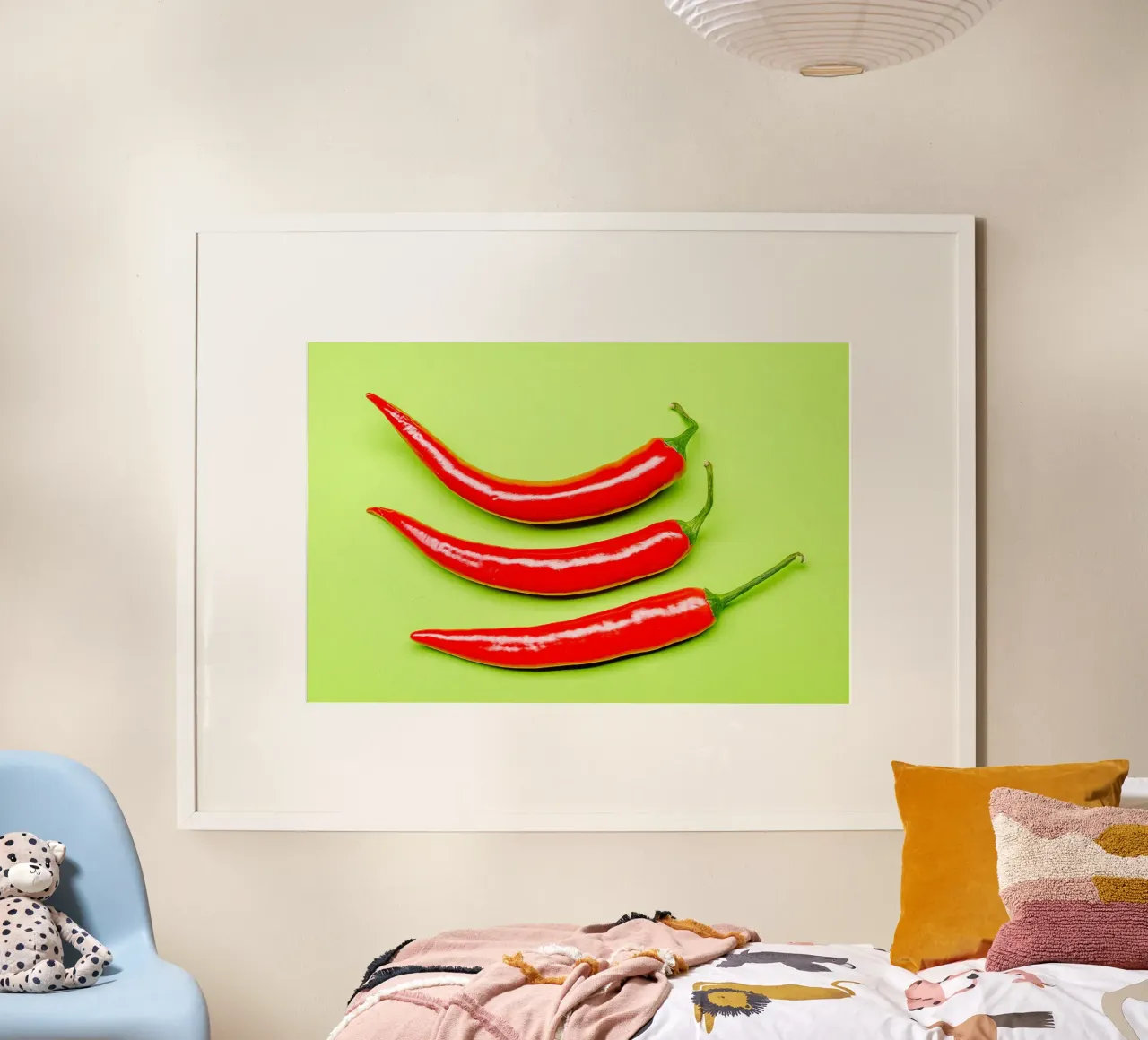 Three red chilli peppers on a green surface poster with aluminum frame by Bilderwelt - Kunst für die Wand