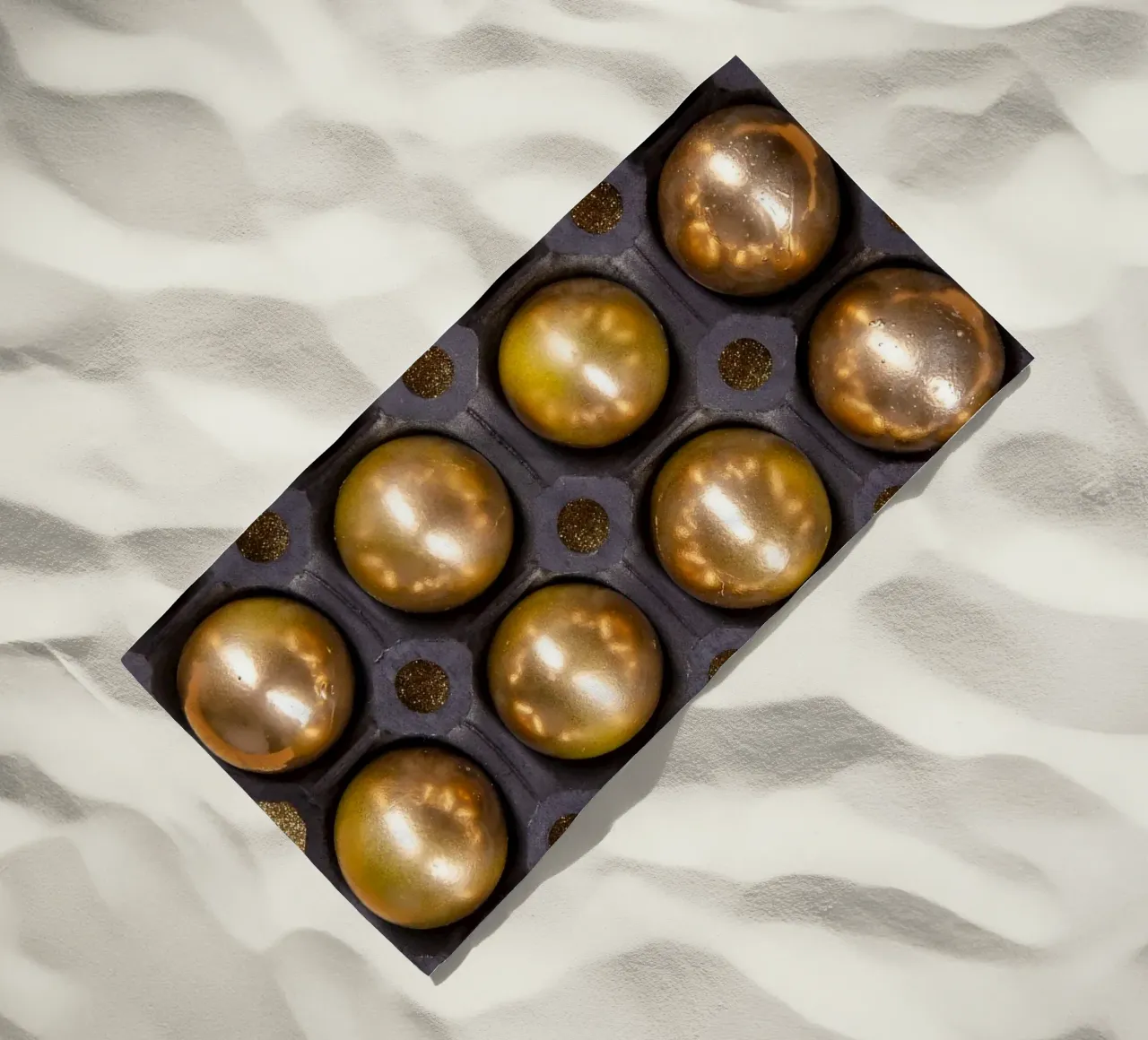 Gold spheres in a symmetrical presentation grid beach towel by Bilderwelt - Kunst für die Wand