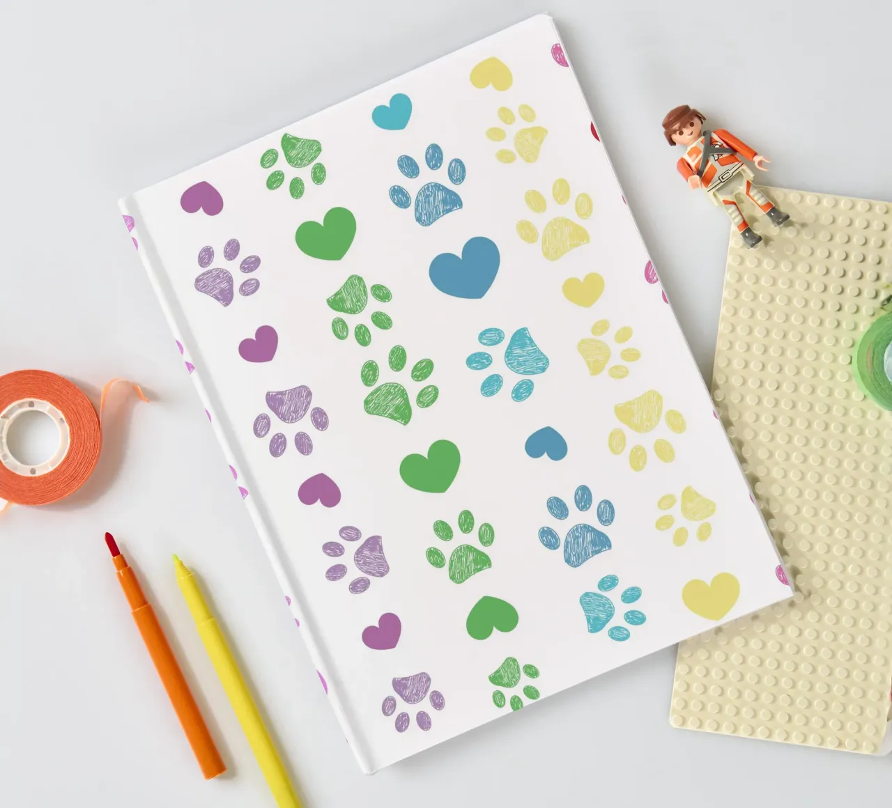 Colorful paw print with hearts pattern notebook by gulsengunel