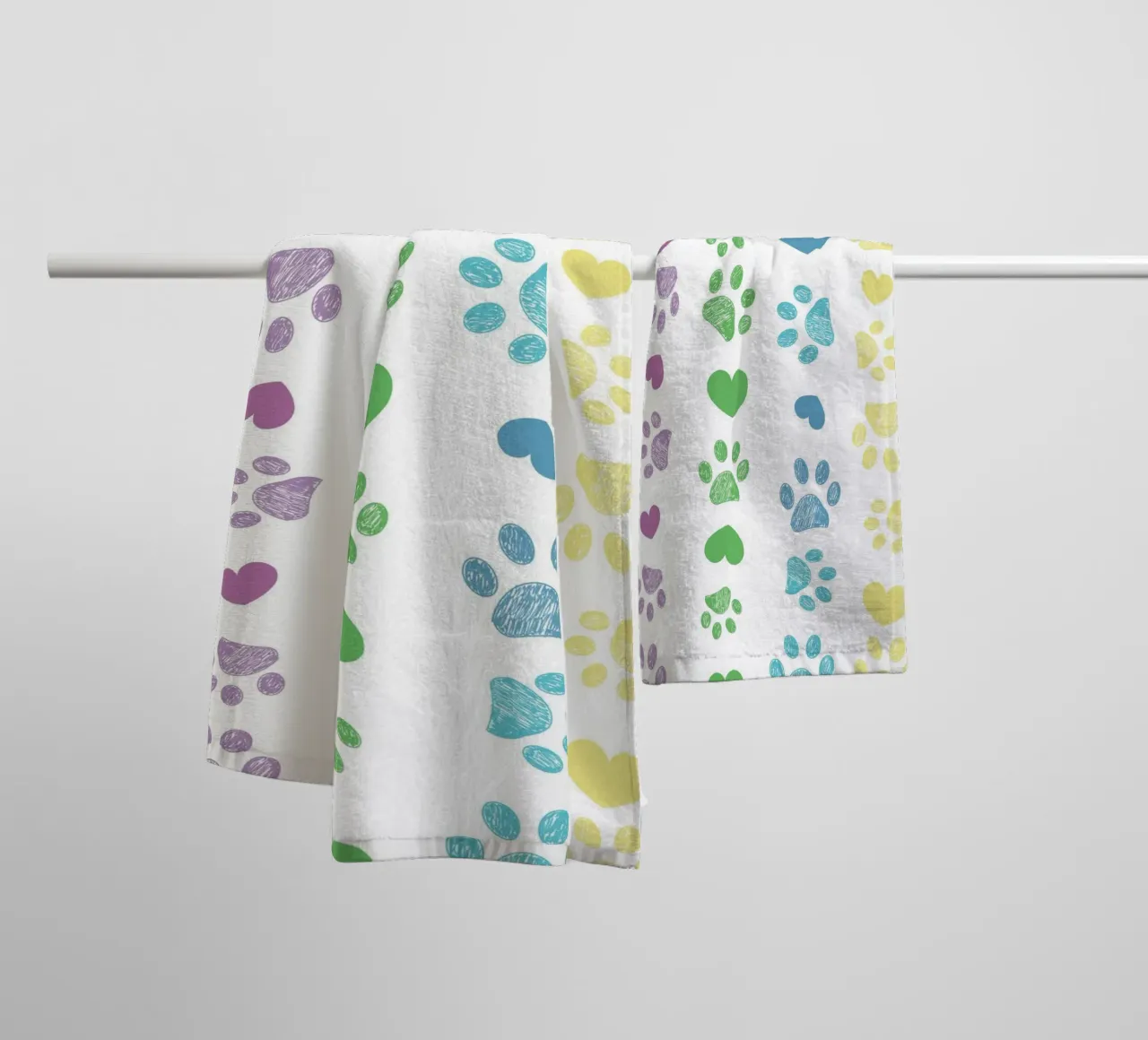 Colorful paw print with hearts pattern towel by gulsengunel