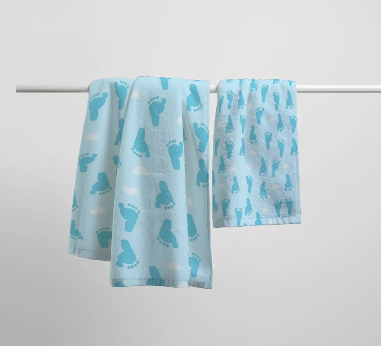 Baby foot print and hearts pattern with blue background towel by gulsengunel