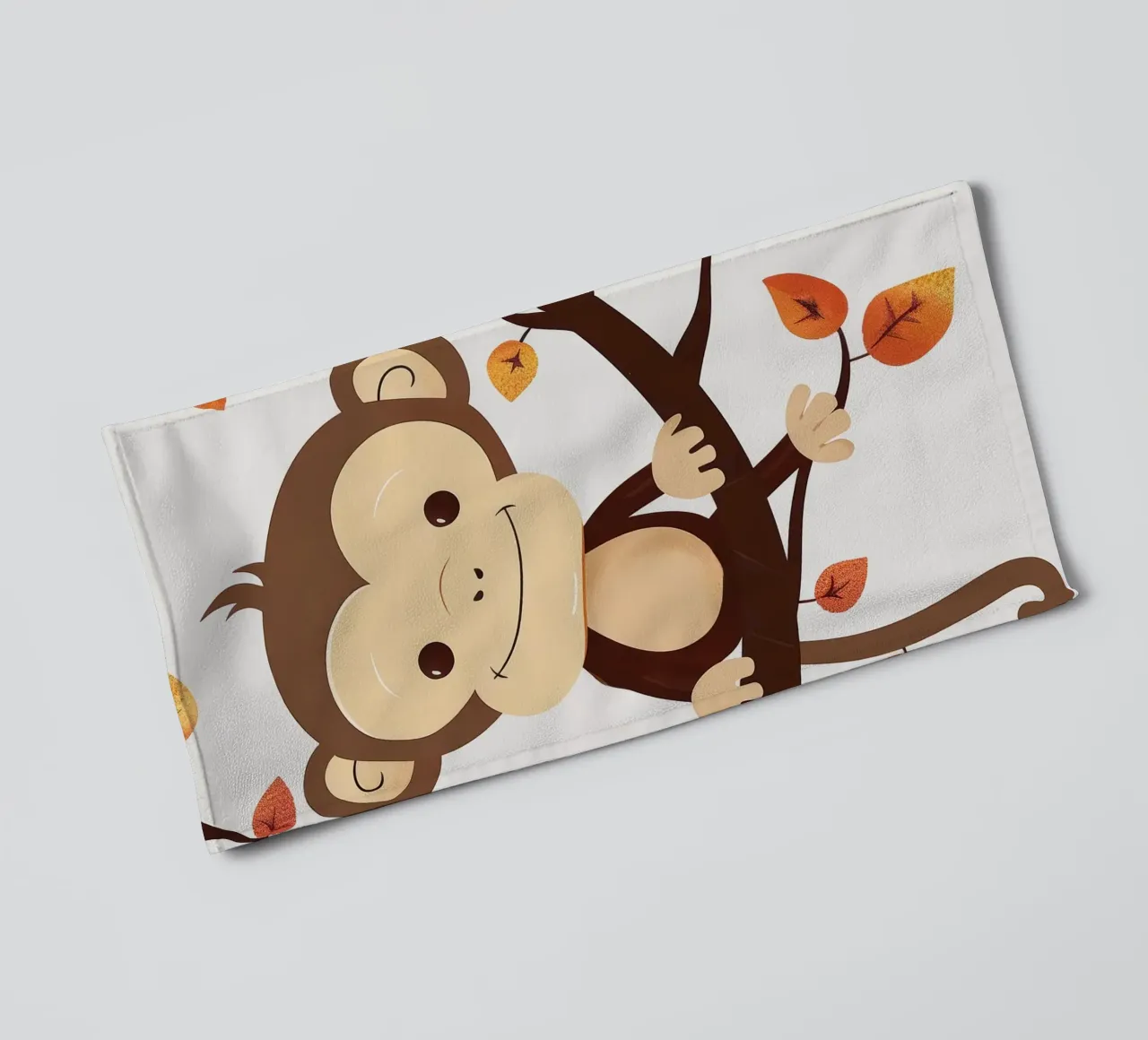 monkey sits on a tree branch surrounded by autumn leaves towel by DesignDoodle