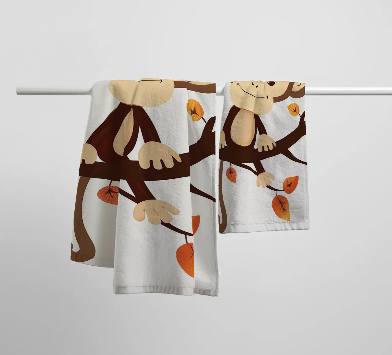 monkey sits on a tree branch surrounded by autumn leaves towel by DesignDoodle