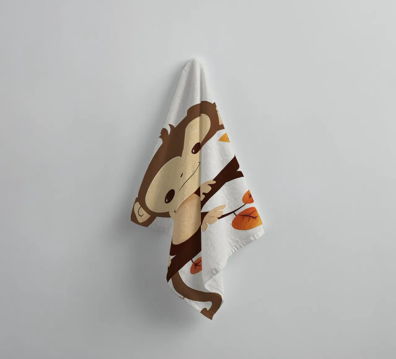 monkey sits on a tree branch surrounded by autumn leaves towel by DesignDoodle