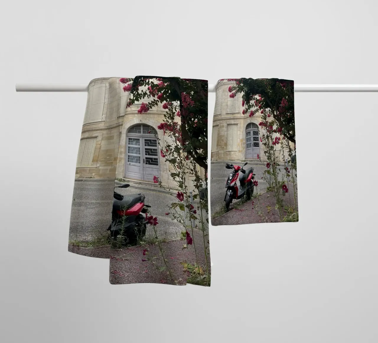 Motorbike in front of a beige house with a flowering shrub in France towel by Sous le ciel