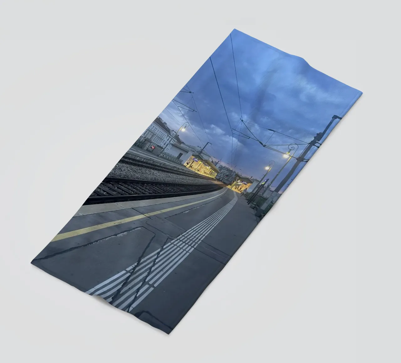 Railway station in Vienna under an overcast sky beach towel by Sous le ciel