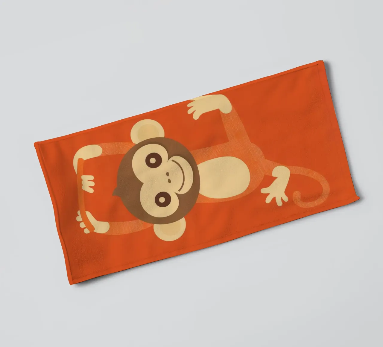 Playful monkey swings happily, showcasing energy and joy towel by DesignDoodle