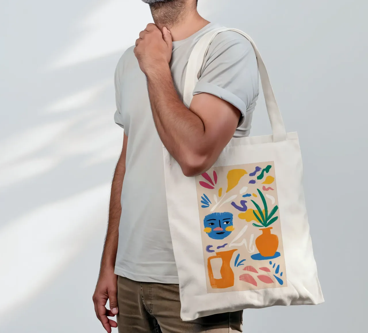 Gefragmenteerd gezicht en flora jute draagtas van Mythy Brush