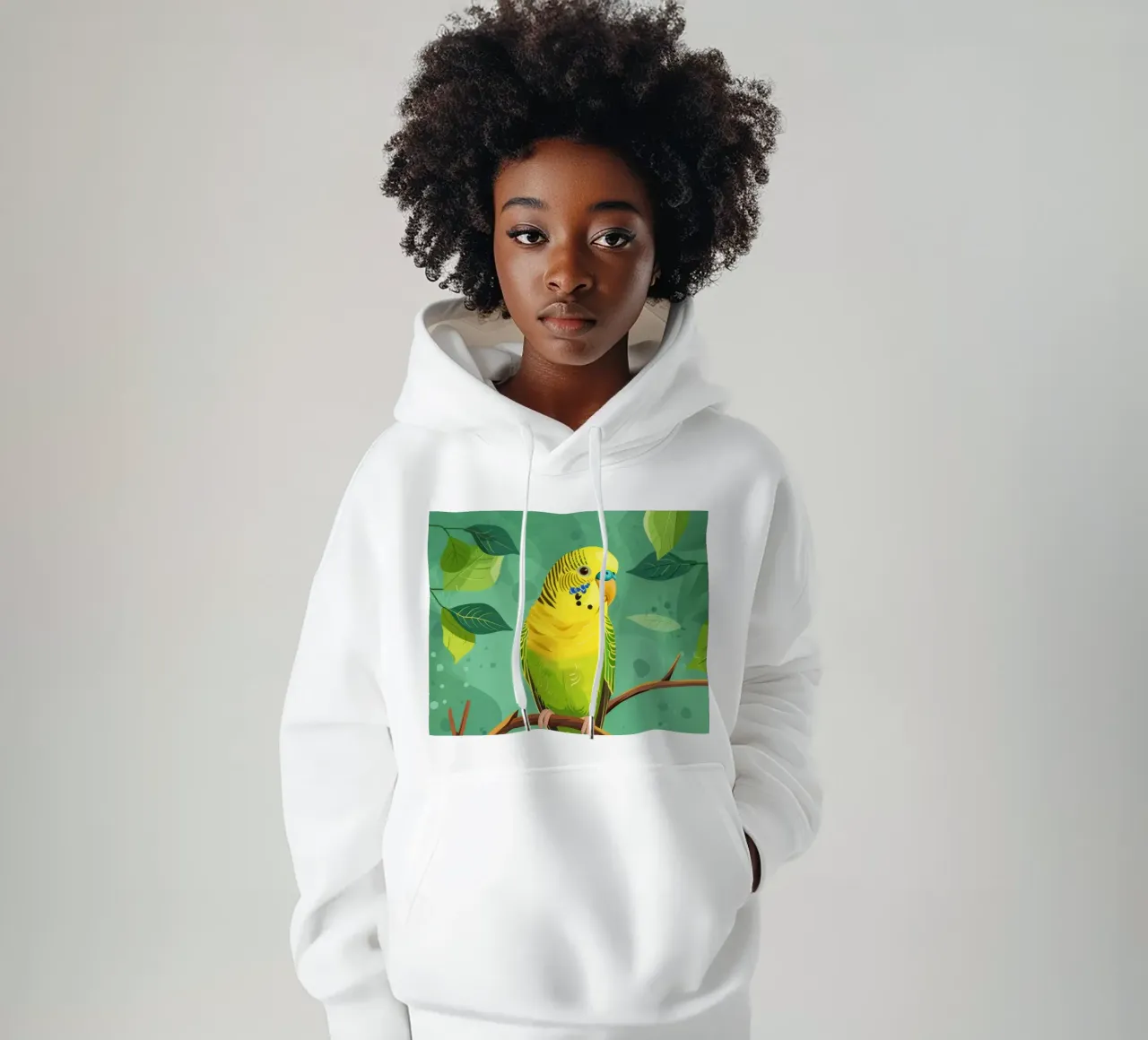 Pappagallino giallo verde appollaiato su un ramo con foglie felpa con cappuccio da DesignDoodle