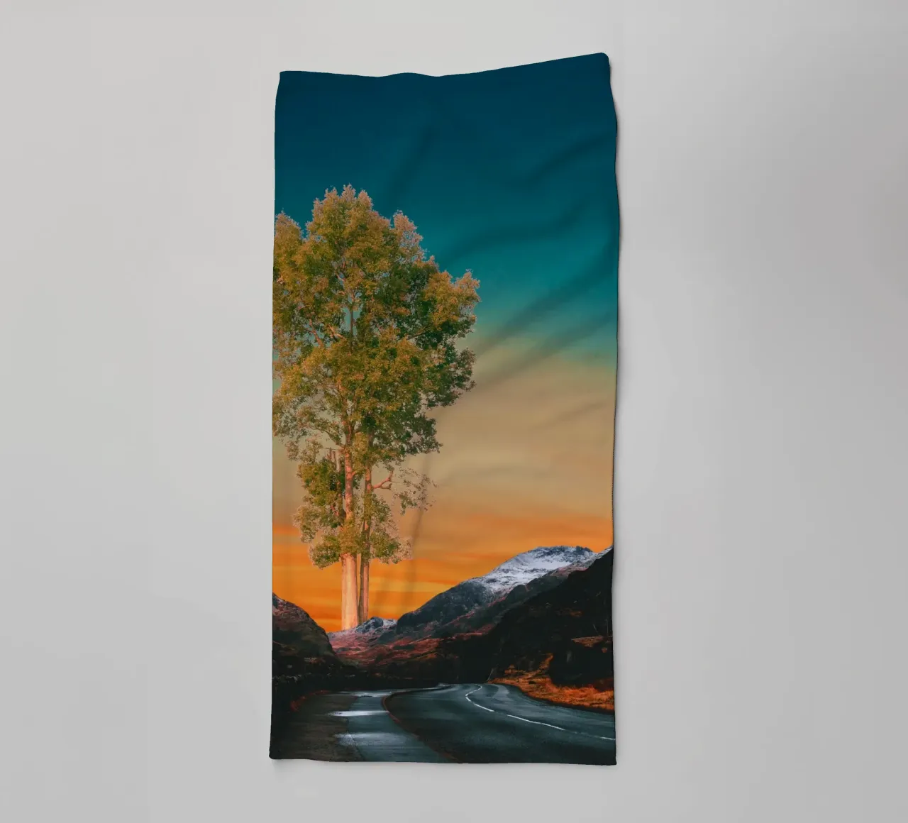 Road through mountains with a tree towel by Berwies Artwork