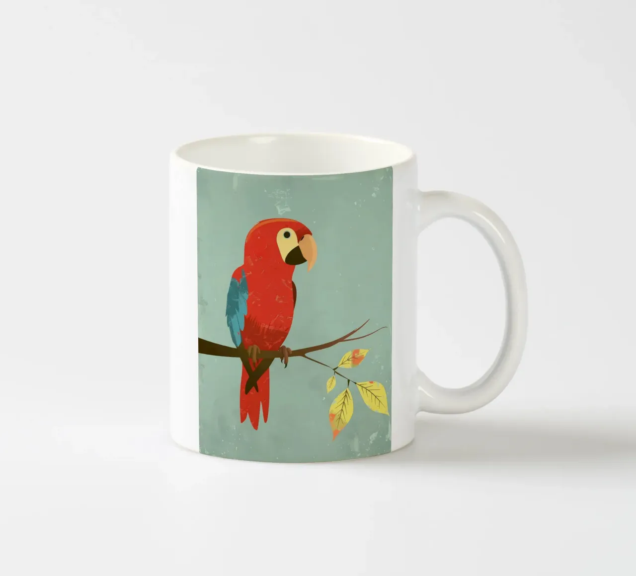 Pappagallo rosso appollaiato su un ramo circondato da foglie d'autunno tazza in ceramica da DesignDoodle