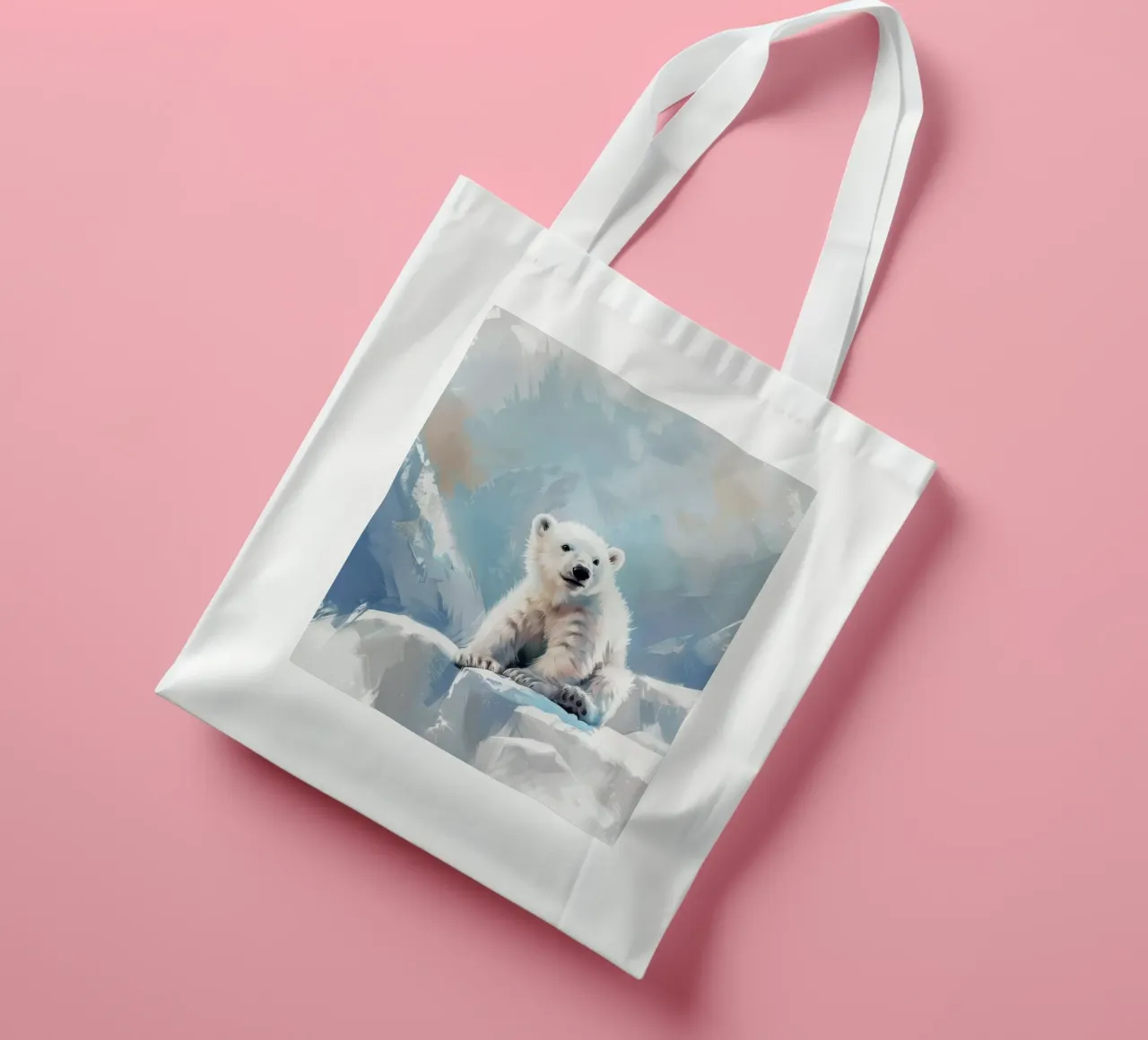 Polar bear cub resting on an ice ledge in a snowy wilderness tote bag by DesignDoodle