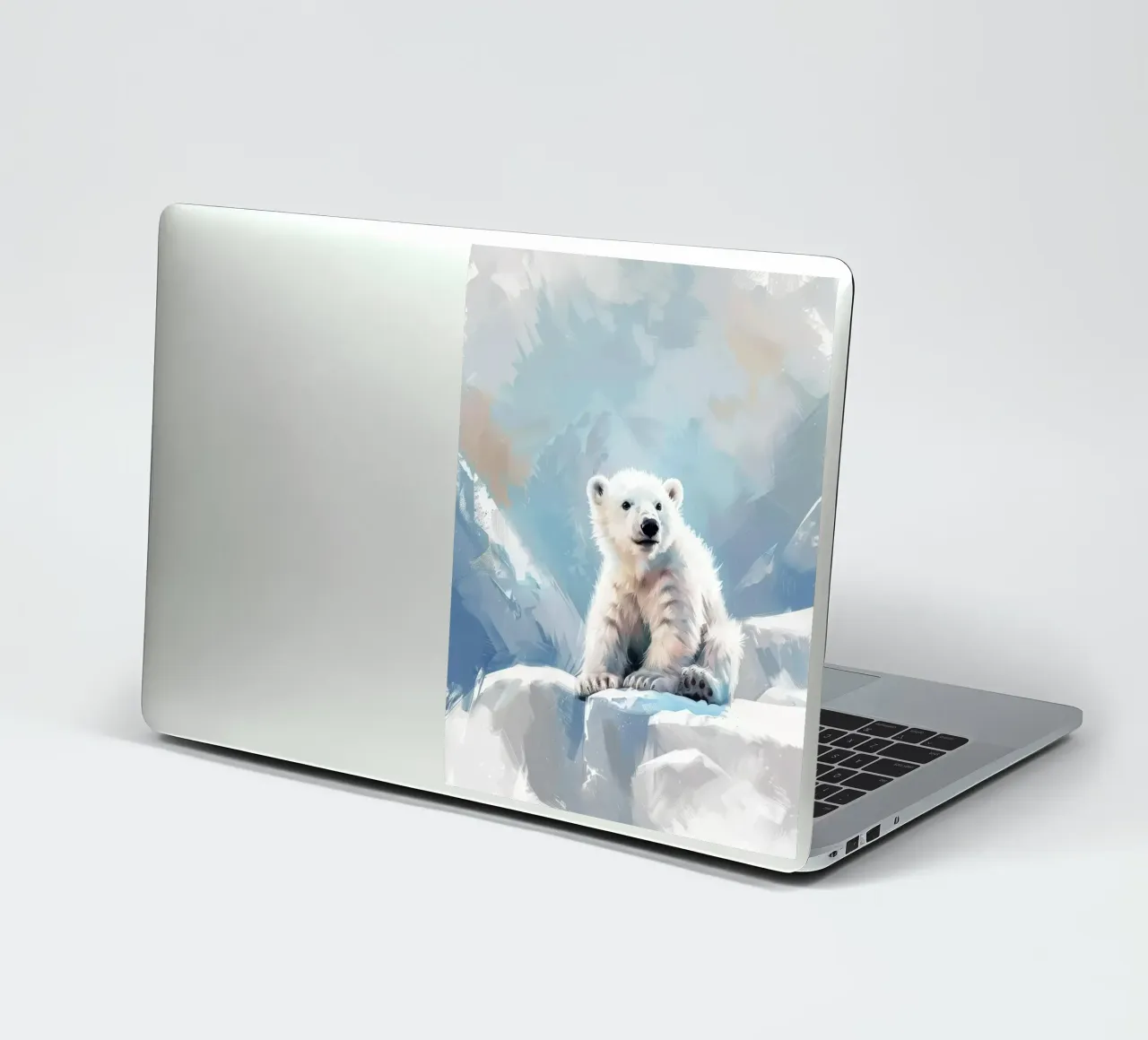 Polar bear cub resting on an ice ledge in a snowy wilderness sticker by DesignDoodle