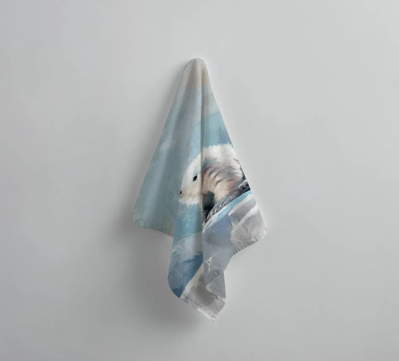 Polar bear cub resting on an ice ledge in a snowy wilderness towel by DesignDoodle