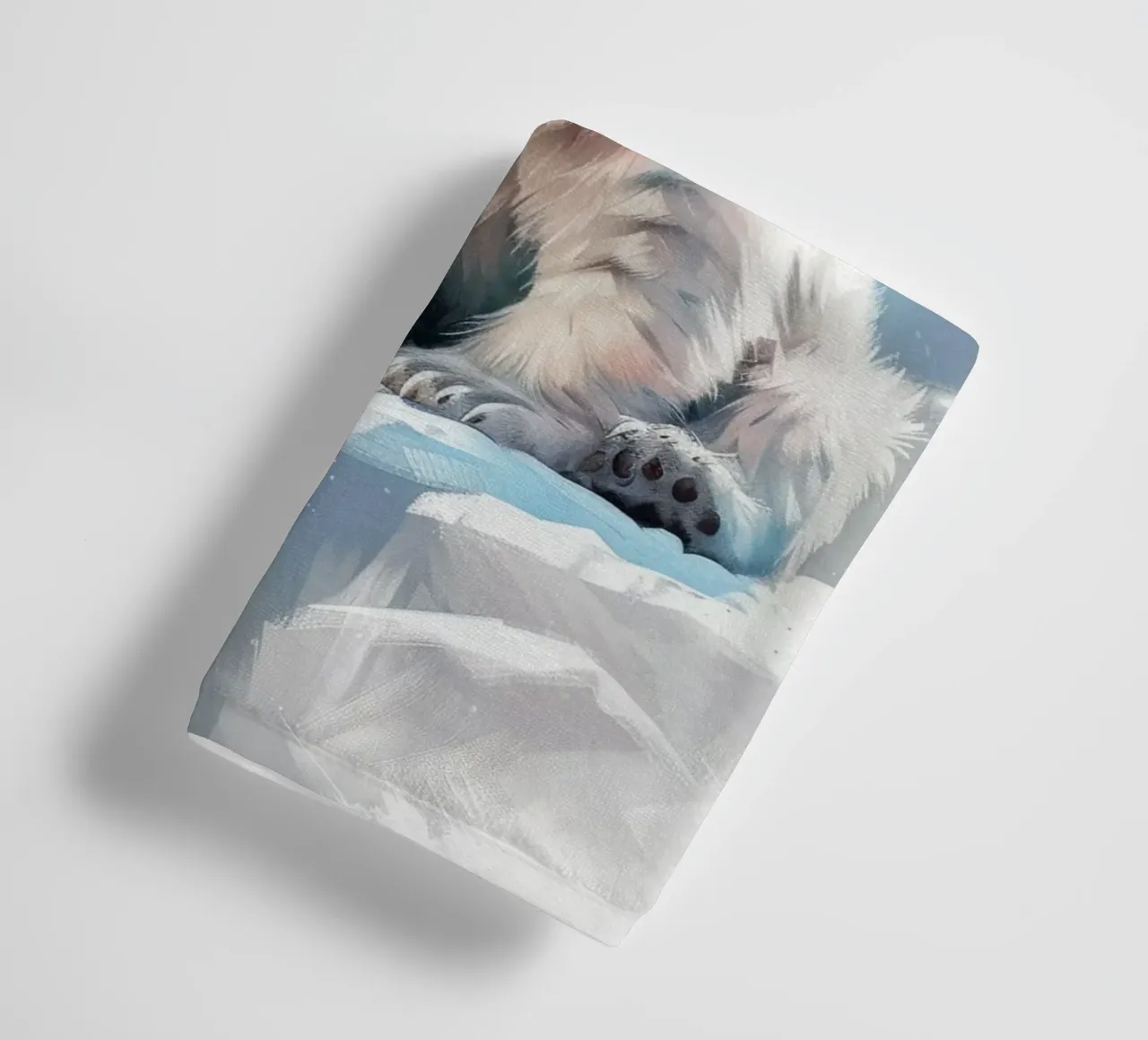 Polar bear cub resting on an ice ledge in a snowy wilderness towel by DesignDoodle