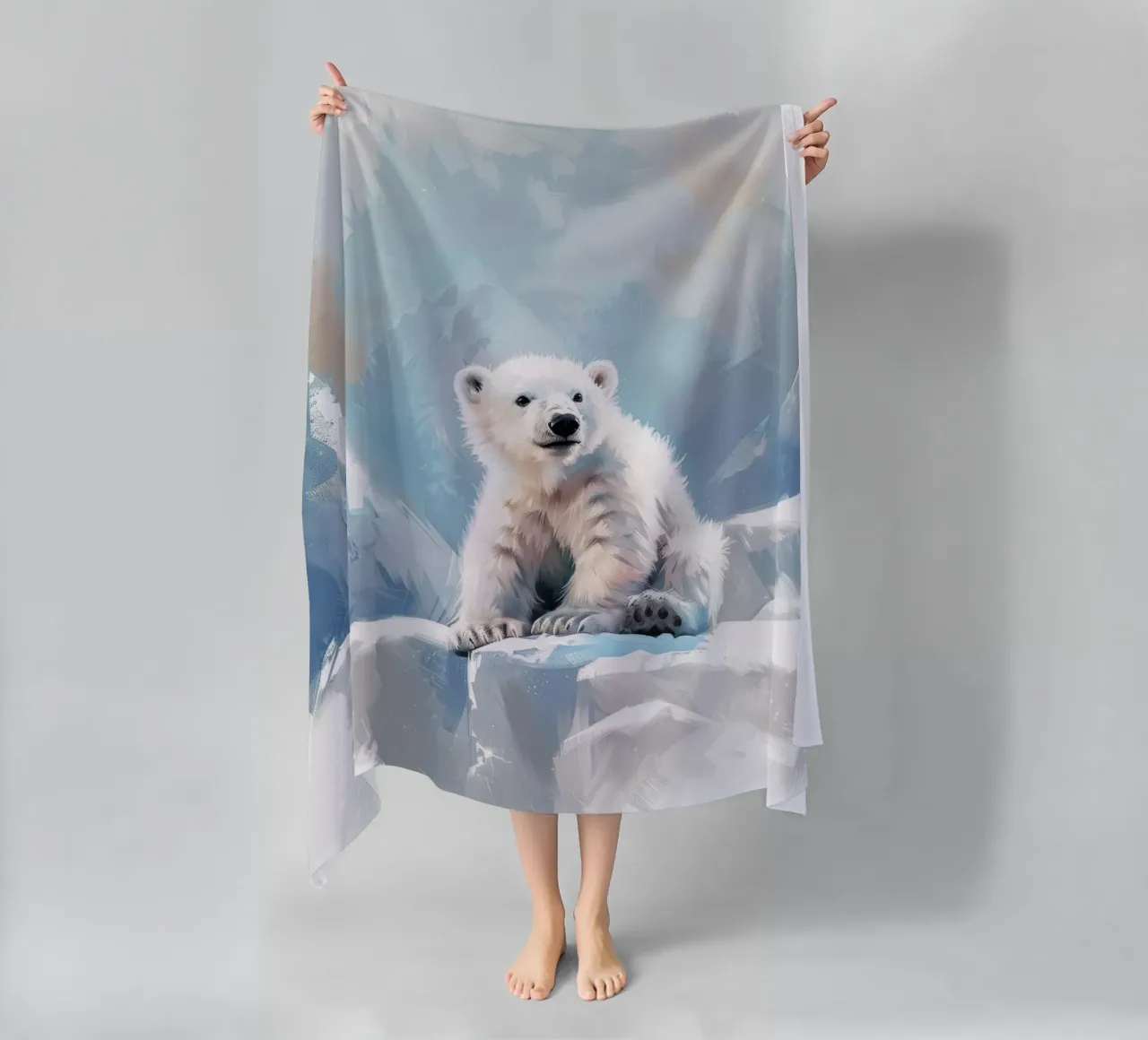 Polar bear cub resting on an ice ledge in a snowy wilderness beach towel by DesignDoodle