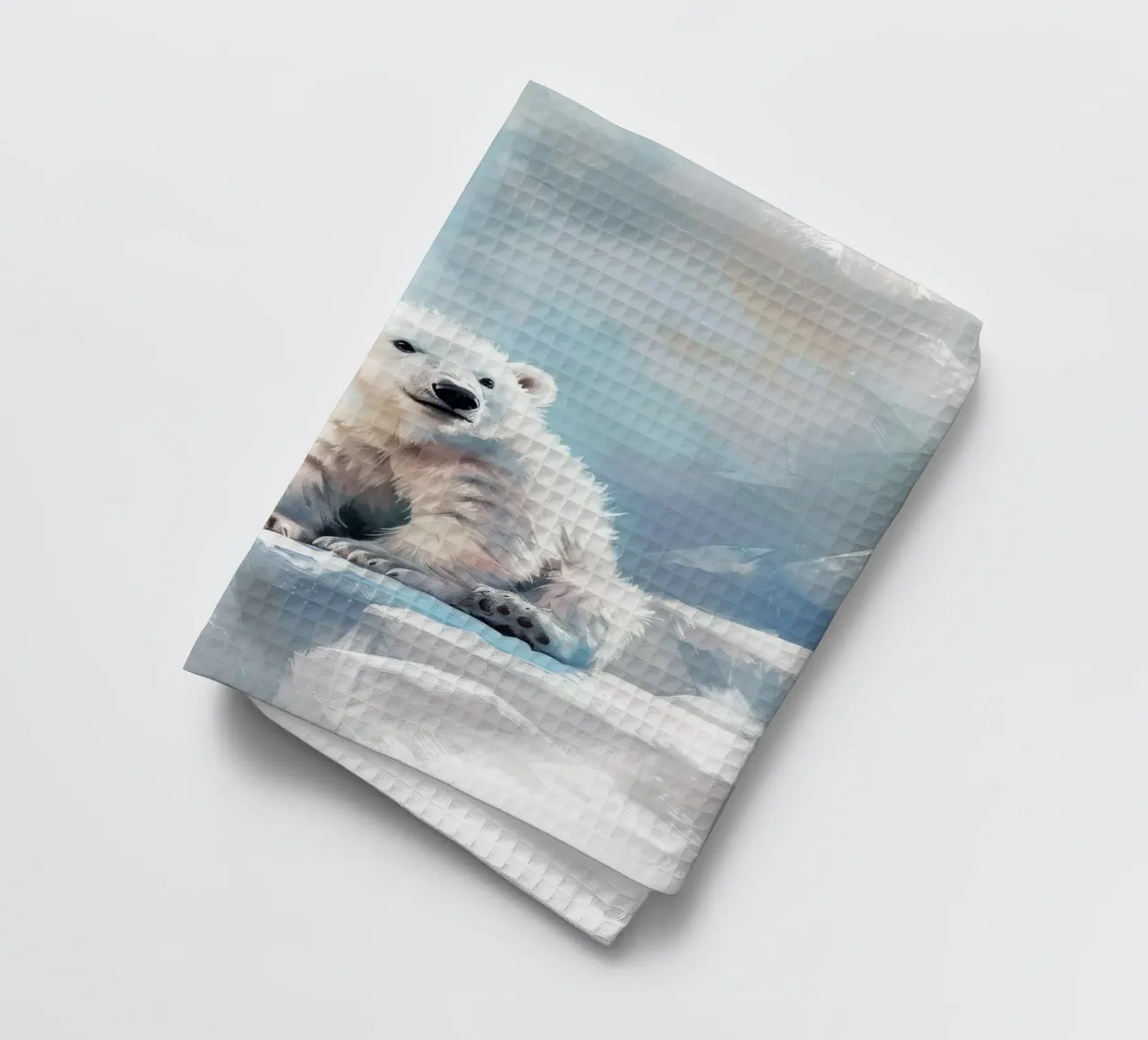 Polar bear cub resting on an ice ledge in a snowy wilderness tea towel by DesignDoodle