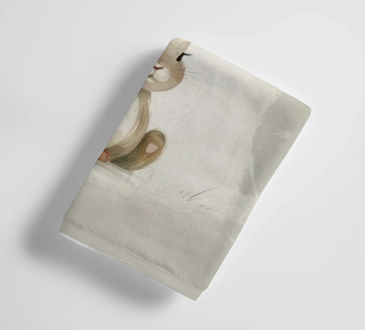 Cute brown bunny sitting on a soft background towel by DesignDoodle
