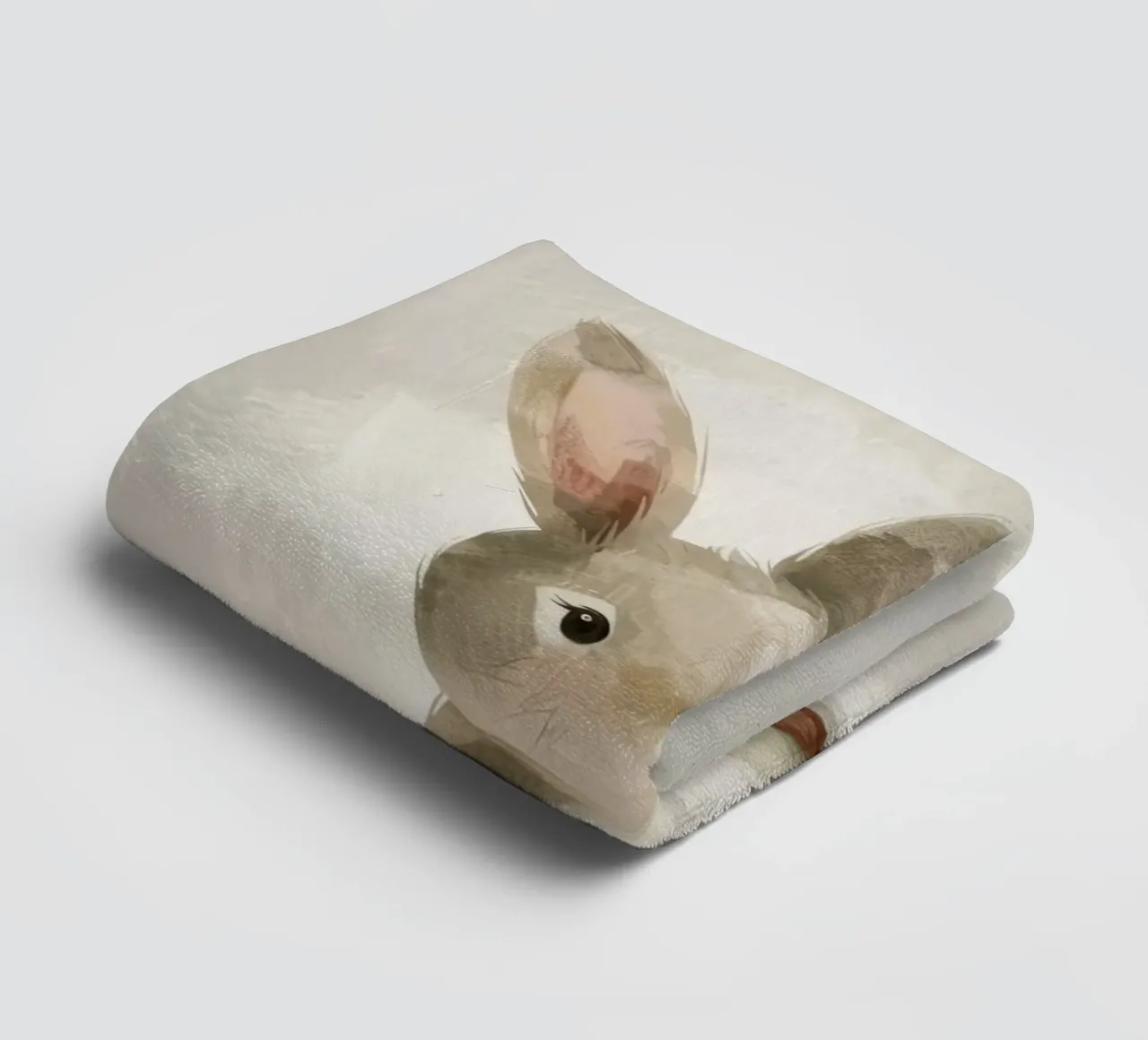 Cute brown bunny sitting on a soft background towel by DesignDoodle