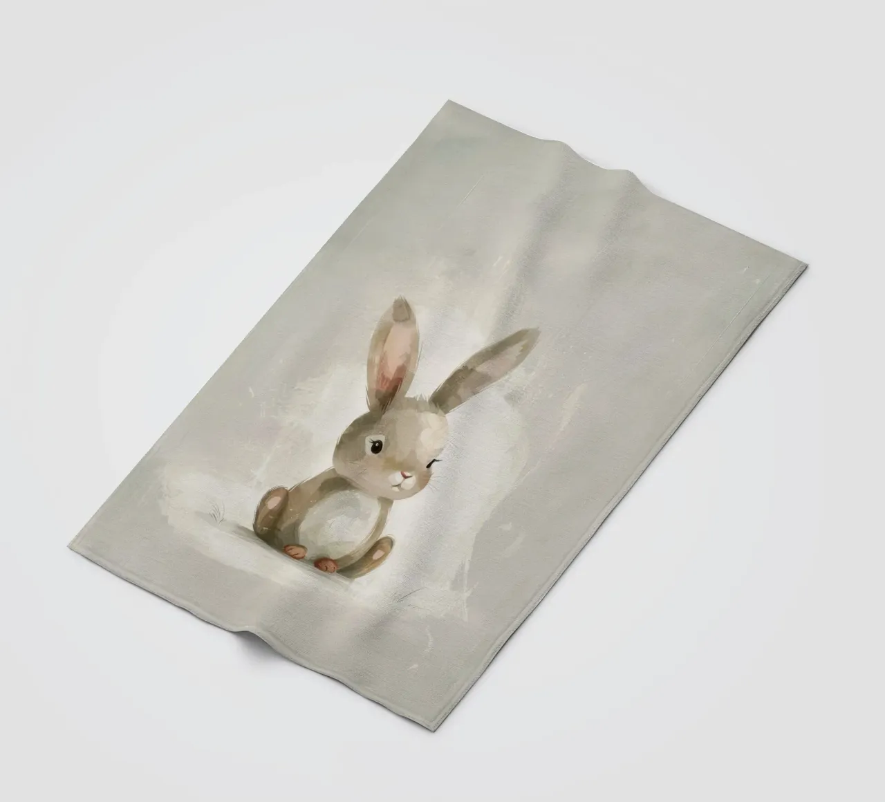 Cute brown bunny sitting on a soft background fleece blanket by DesignDoodle