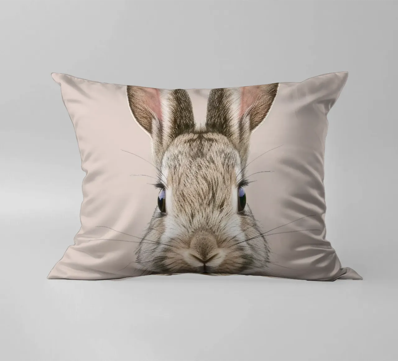 Fluffy rabbit with expressive eyes against a neutral art decorative cushion by DesignDoodle