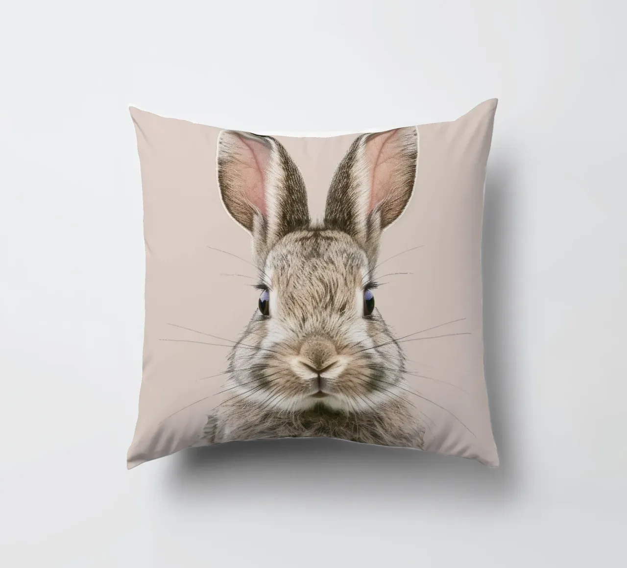 Fluffy rabbit with expressive eyes against a neutral art decorative cushion by DesignDoodle