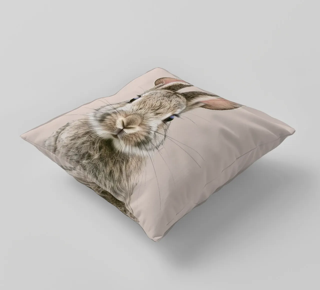 Fluffy rabbit with expressive eyes against a neutral art decorative cushion by DesignDoodle