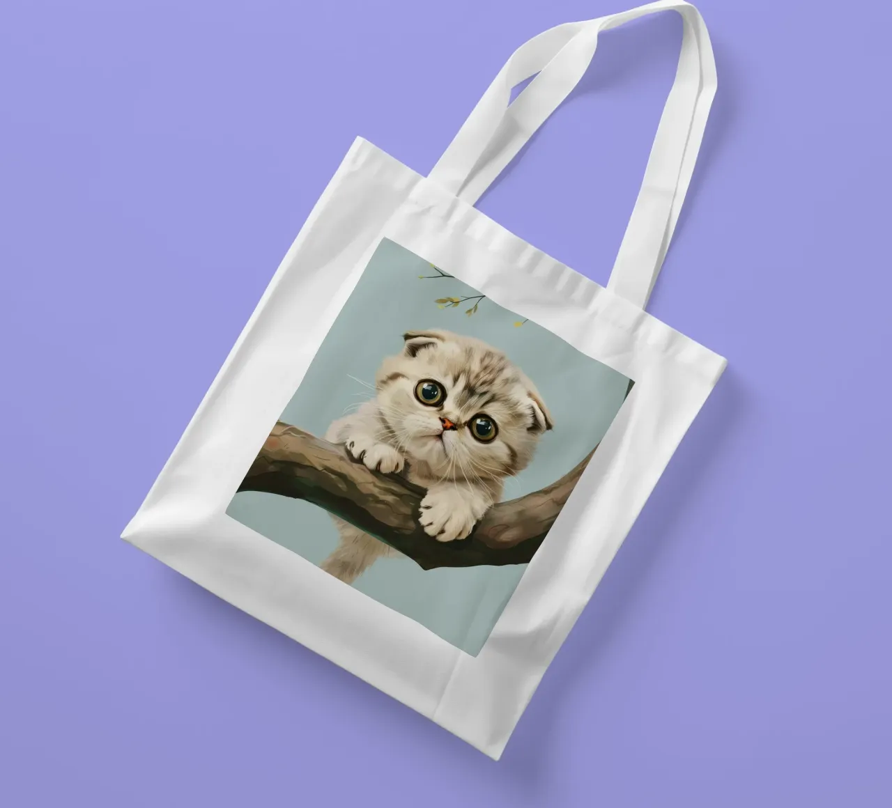 Cute kitten with glowing eyes climbing a branch in spring tote bag by DesignDoodle