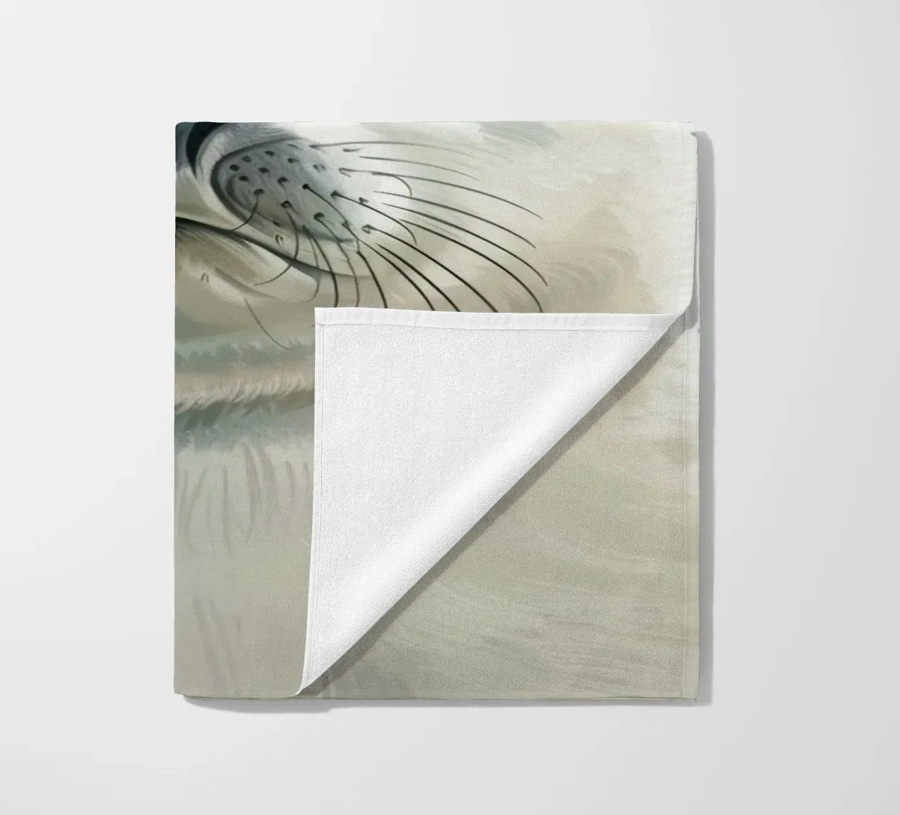 Portrait of a young seal looking curiously with a soft beach towel by DesignDoodle