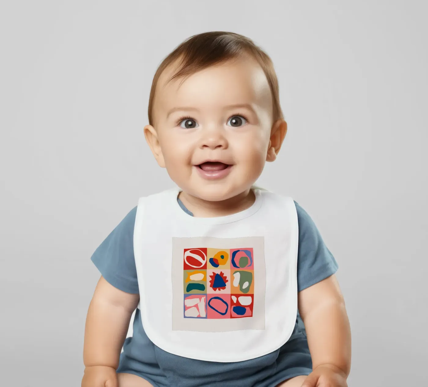 Playful Shape Patchwork baby bib by Prism Ritual