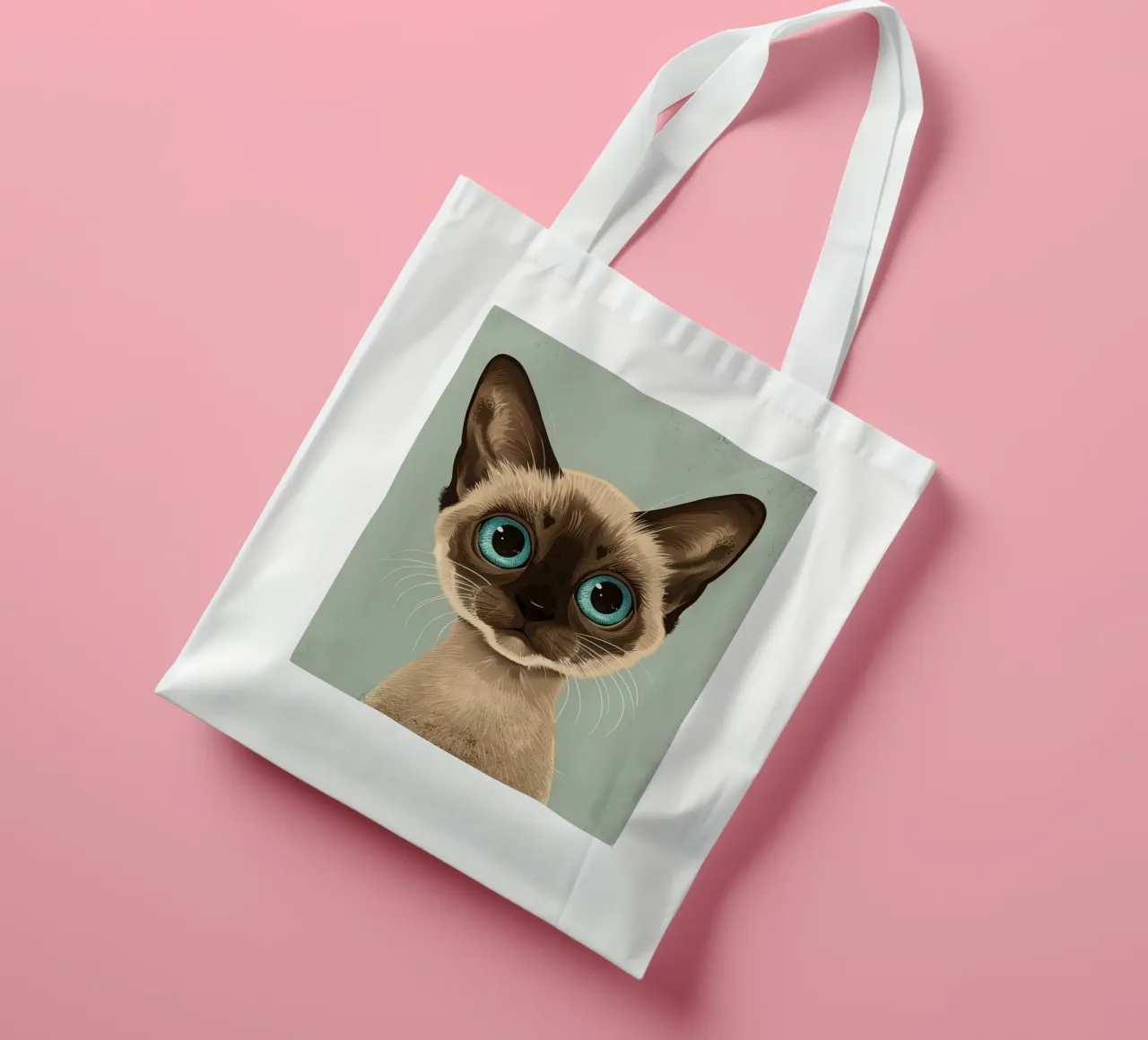 Adorable Siamese cat with large blue eyes and expressive tote bag by DesignDoodle