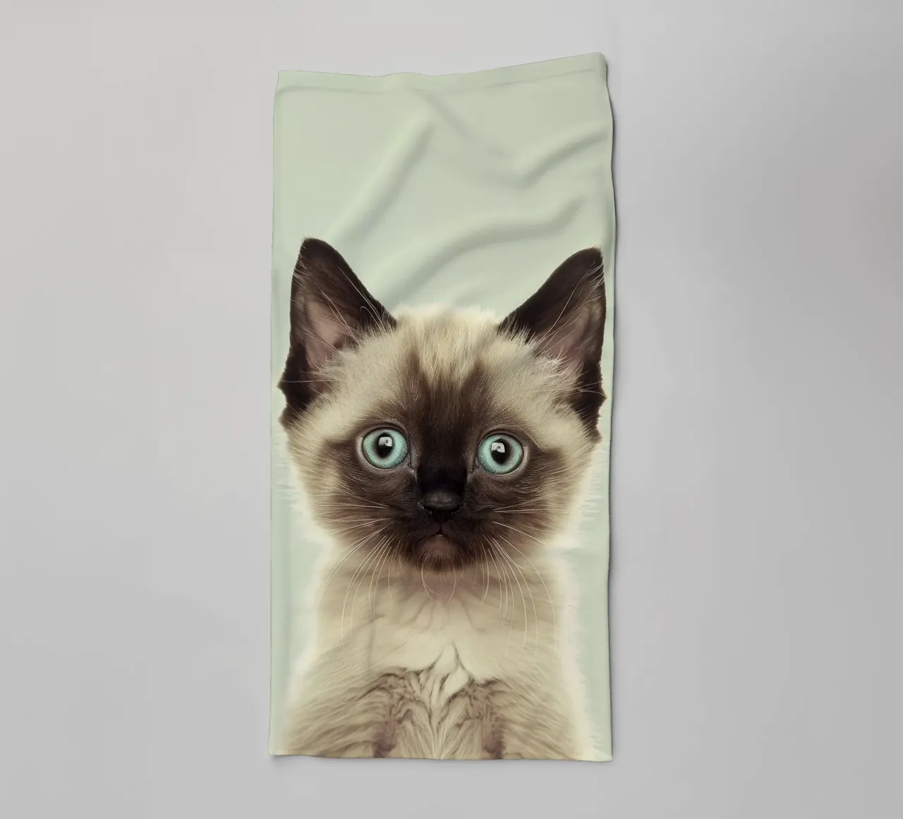 Cute kitten with striking blue eyes and distinct markings towel by DesignDoodle