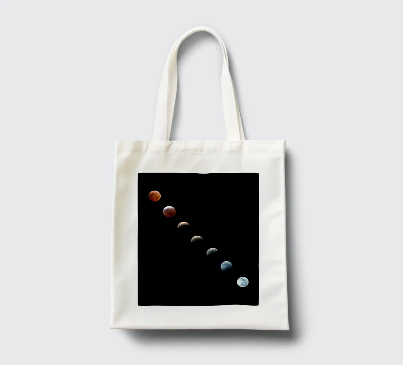 moon lunar-eclipse tote bag by Earthly Visions