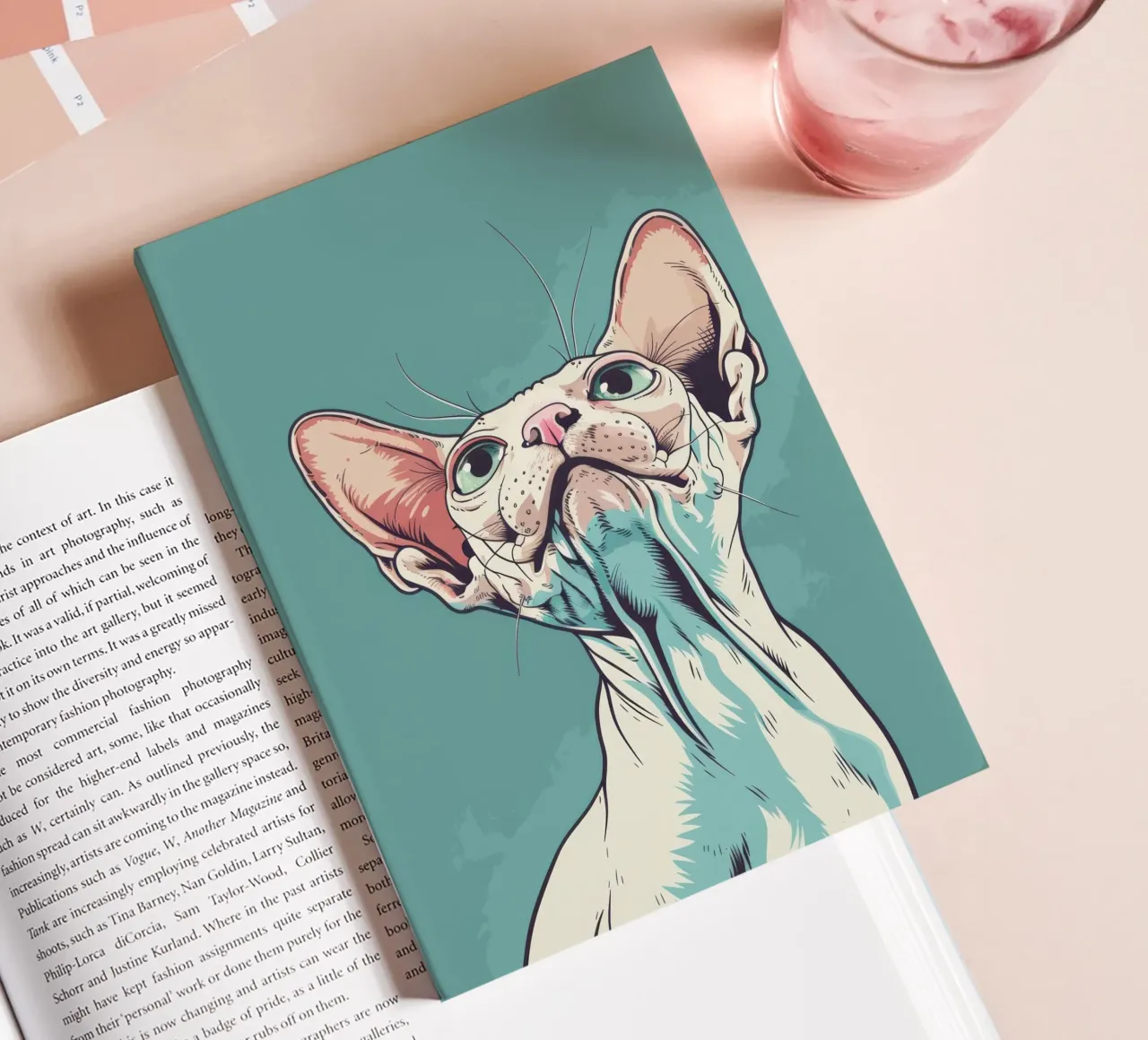 Sphynx cat gazing upwards in a simple, abstract background w notebook by DesignDoodle
