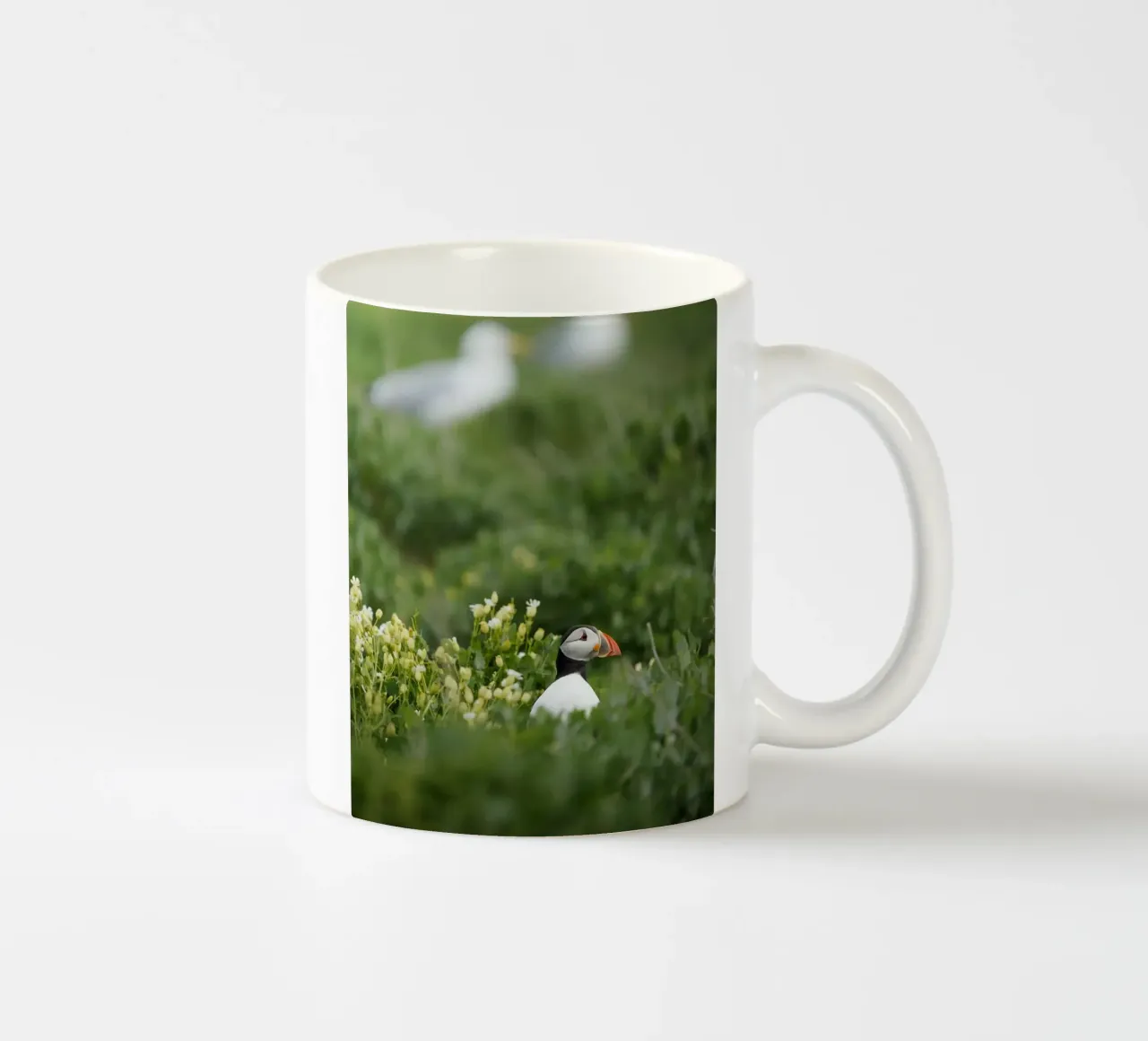 Puffin in flower fields ceramic mug by Tom's Wildlife